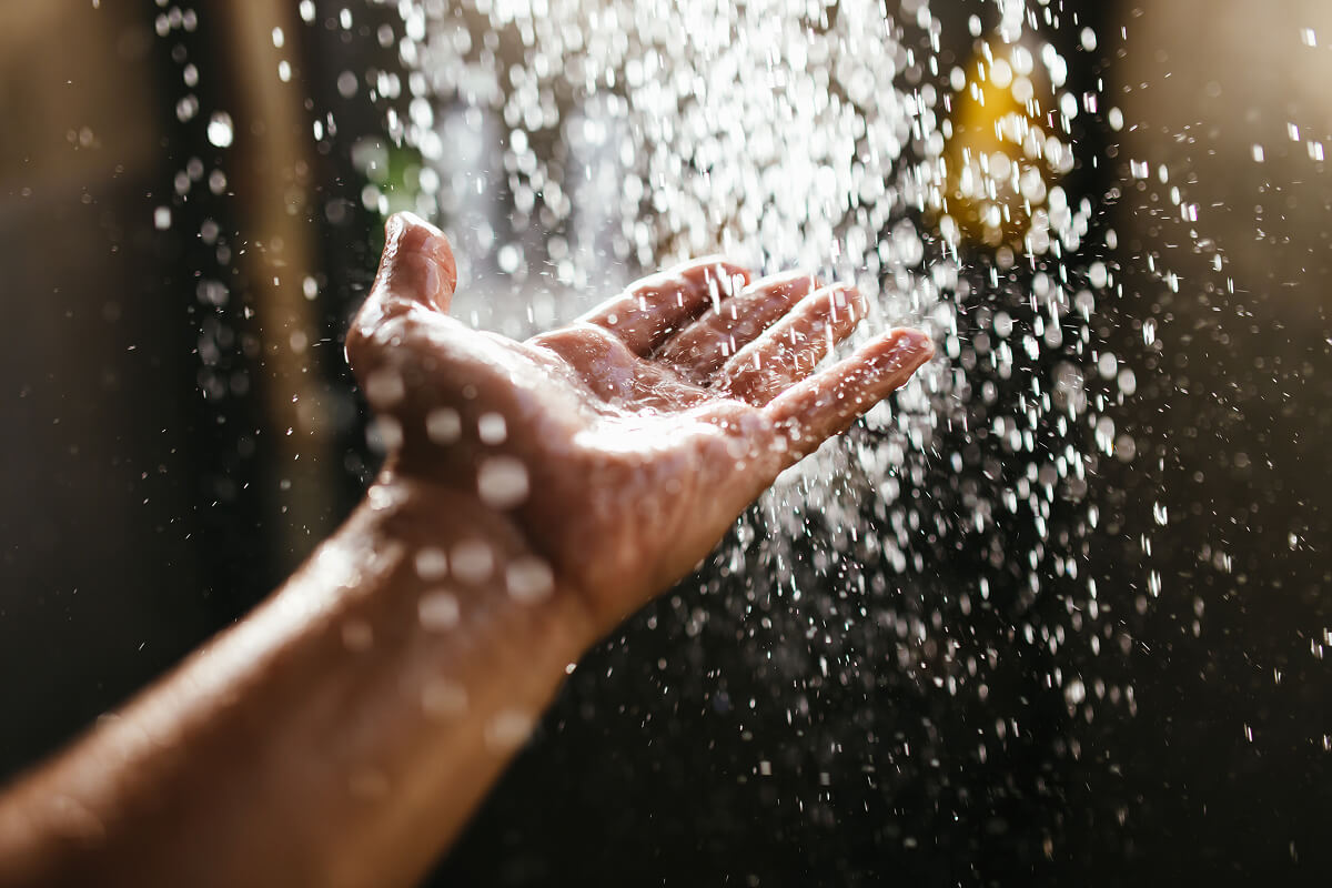 Hand with water falling onto it